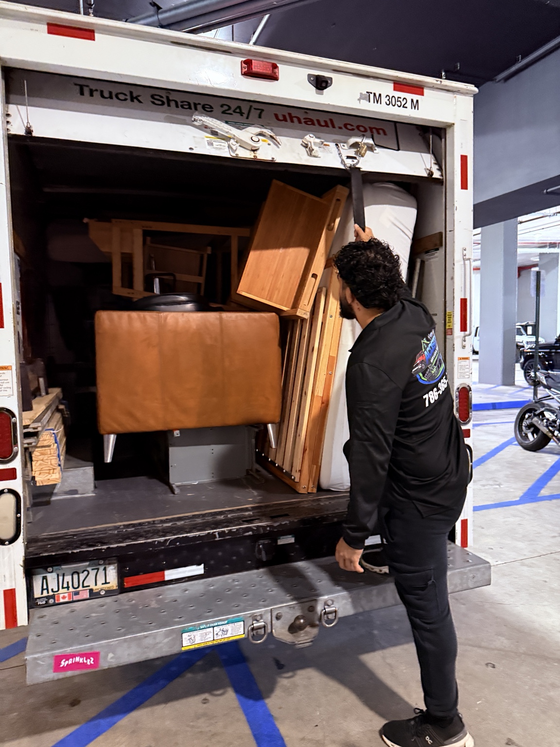 Maikel checking a professionally loaded moving truck