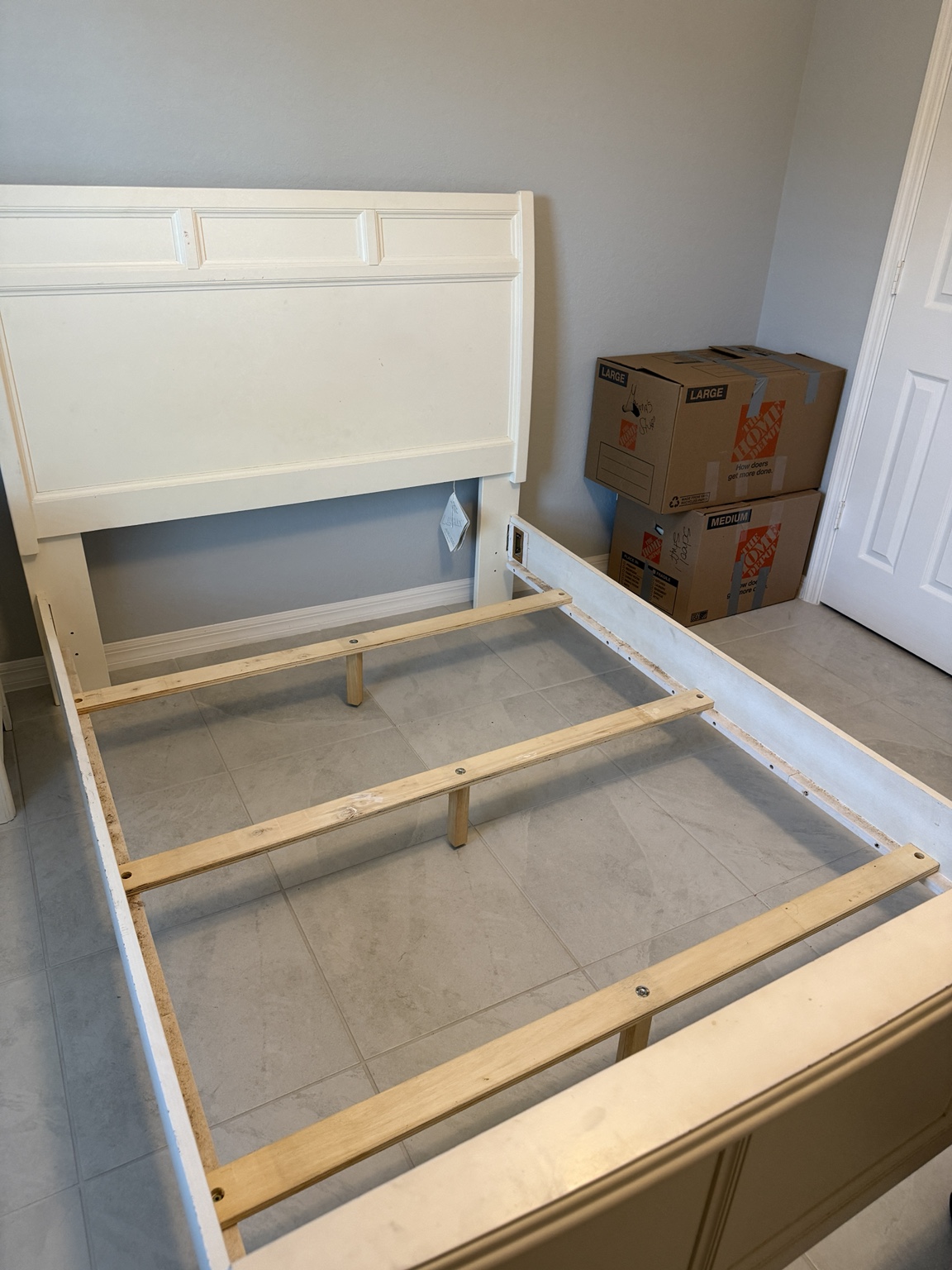 Bed frame rails and center supports installed during an Acosta Services Group handyman project